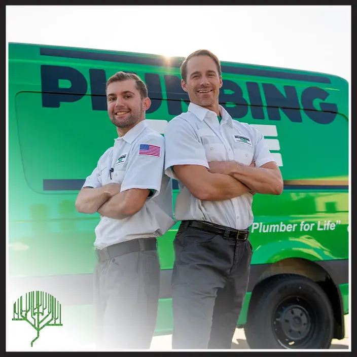 Two Plumbing Tree plumbers in uniform standing in front of a branded service van in San Diego, CA
